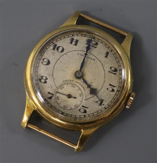 A gentlemans mid size 1930s? 18ct gold manual wind Longines wrist watch, no strap.